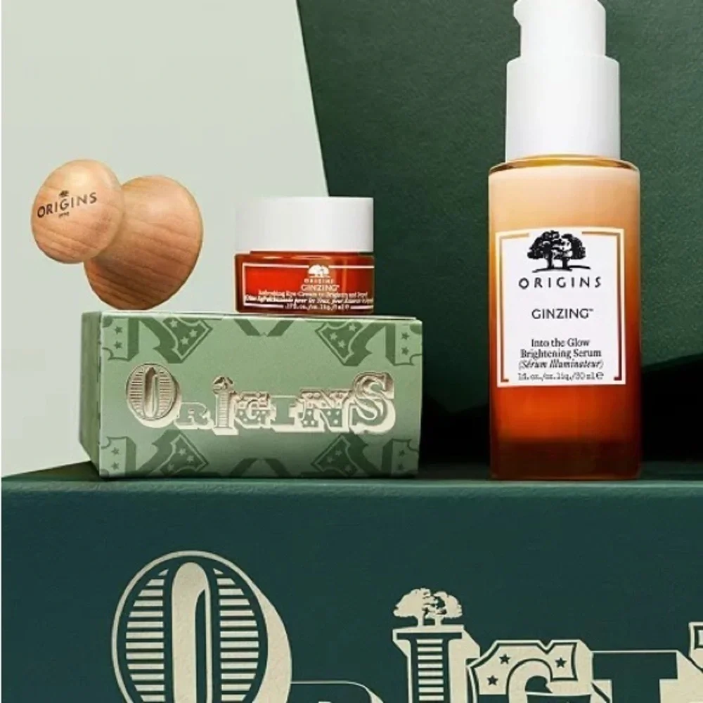 Origins radiance boosting serum , eye cream set and eye massage tool